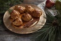 Apple Dumplings on Gold Plate with Greenery on Rustic Wood Royalty Free Stock Photo