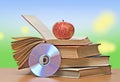 Apple, dvd, and books Royalty Free Stock Photo