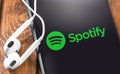 Apple Earpods and iPhone with Spotify logo