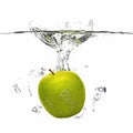 Apple falling into the water with splash on white Royalty Free Stock Photo