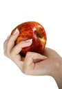 Apple in a female hand Royalty Free Stock Photo