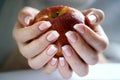 Apple in a female hand Royalty Free Stock Photo