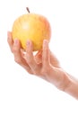 Apple in a female hand Royalty Free Stock Photo