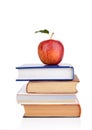 Apple on few school books on a white background