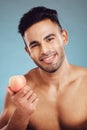 Apple, fitness and man in a studio portrait before eating healthy fruit on a vegan diet and wellness lifestyle Royalty Free Stock Photo