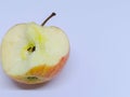 Isolated apple that has been bitten with a white background