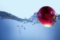 Apple fresh red splash into the water,red fruit Royalty Free Stock Photo