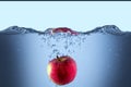 Apple fresh red splash into the water,red fruit food Royalty Free Stock Photo