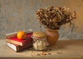 Apple fruit and old book with seashell decoration Royalty Free Stock Photo