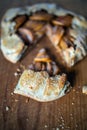 Apple galette - pie on white baking parchment. Copy space, flat lay Royalty Free Stock Photo