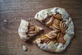 Apple galette - pie on white baking parchment. Copy space, flat lay Royalty Free Stock Photo