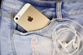 Apple Gold iPhone 5s in a blue denim pocket