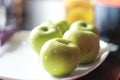 Apple, green apples on a plate, in drops of water