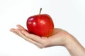 Apple in a hand Royalty Free Stock Photo