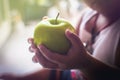 Apple in the hands of children Royalty Free Stock Photo