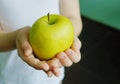 Apple in hands. Healthy food. Spring vitamins.