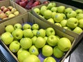 Baskets of red and green apples for sale in supermarkets
