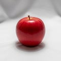 Apple has a glossy texture, with a visible stem protruding from the Royalty Free Stock Photo