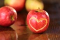 Apple heart on a wet table Royalty Free Stock Photo