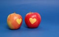 Apple hearts on blue background