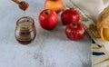 Apple and honey, kosher traditional food of jewish New Year Rosh Hashana talit and shofar