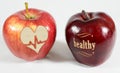 1 apple with the inscription healthy and an apple with a heart Royalty Free Stock Photo