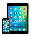 Apple iPad Air 2 and iPhone 5s with iOS 9 on the displays