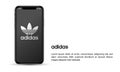 Apple iPhone and adidas mobile application for illustrative editorial use