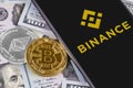 Apple iPhone and Binance logo and bitcoin, ethereum and dollars. Royalty Free Stock Photo