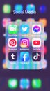 Apple iPhone black smartphone screen showing the Social Media icons bundle, closeup