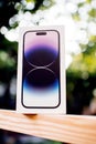 apple iphone box white defocused bokeh garden background pro se iphone xr 2023 Royalty Free Stock Photo