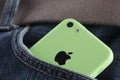 Apple iPhone 5C Green Color in a pocket of jeans Royalty Free Stock Photo