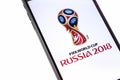 Apple iPhone with FIFA World Cup Russia 2018 logo on the white b Royalty Free Stock Photo