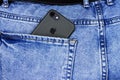 Apple iPhone in a pocket of worn jeans Royalty Free Stock Photo