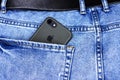 Apple iPhone in a pocket of worn jeans Royalty Free Stock Photo