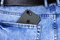 Apple iPhone in a pocket of worn jeans Royalty Free Stock Photo