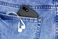 Apple iPhone in a pocket of worn jeans Royalty Free Stock Photo