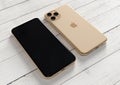 Apple iPhone 11 Pro Gold, 2019, both sides, on table Royalty Free Stock Photo