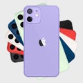 Apple iPhone 12 in purple color. Smart phone. Touch screen. World technology. Kyiv, Ukraine - April 21, 2021