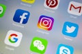 Apple iPhone X with icons of social media facebook, instagram, twitter, snapchat application on screen. Social media icons. Social Royalty Free Stock Photo