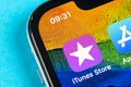 Apple iTunes store application icon on Apple iPhone X smartphone screen close-up. Mobile application icon of itunes store. Social Royalty Free Stock Photo
