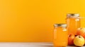 Apple jam in jars on a yellow background. Home canned food