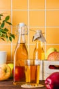 Apple juice in a bottle on a wooden table Royalty Free Stock Photo