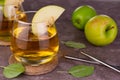 Apple juice in a glass on a gray background.Close-up. Royalty Free Stock Photo