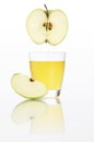 Apple juice in glass isolated on white Royalty Free Stock Photo