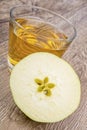 Apple and juice on a wooden background