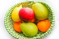 Apple, lemon, pears and mandarines in basket Royalty Free Stock Photo