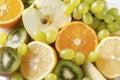 Apple and lemon slices , orange slices, green grapes, kiwi, fresh  fruit Royalty Free Stock Photo