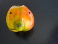 An apple with a little flaw