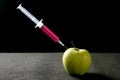 Apple manipulation with syringe Royalty Free Stock Photo